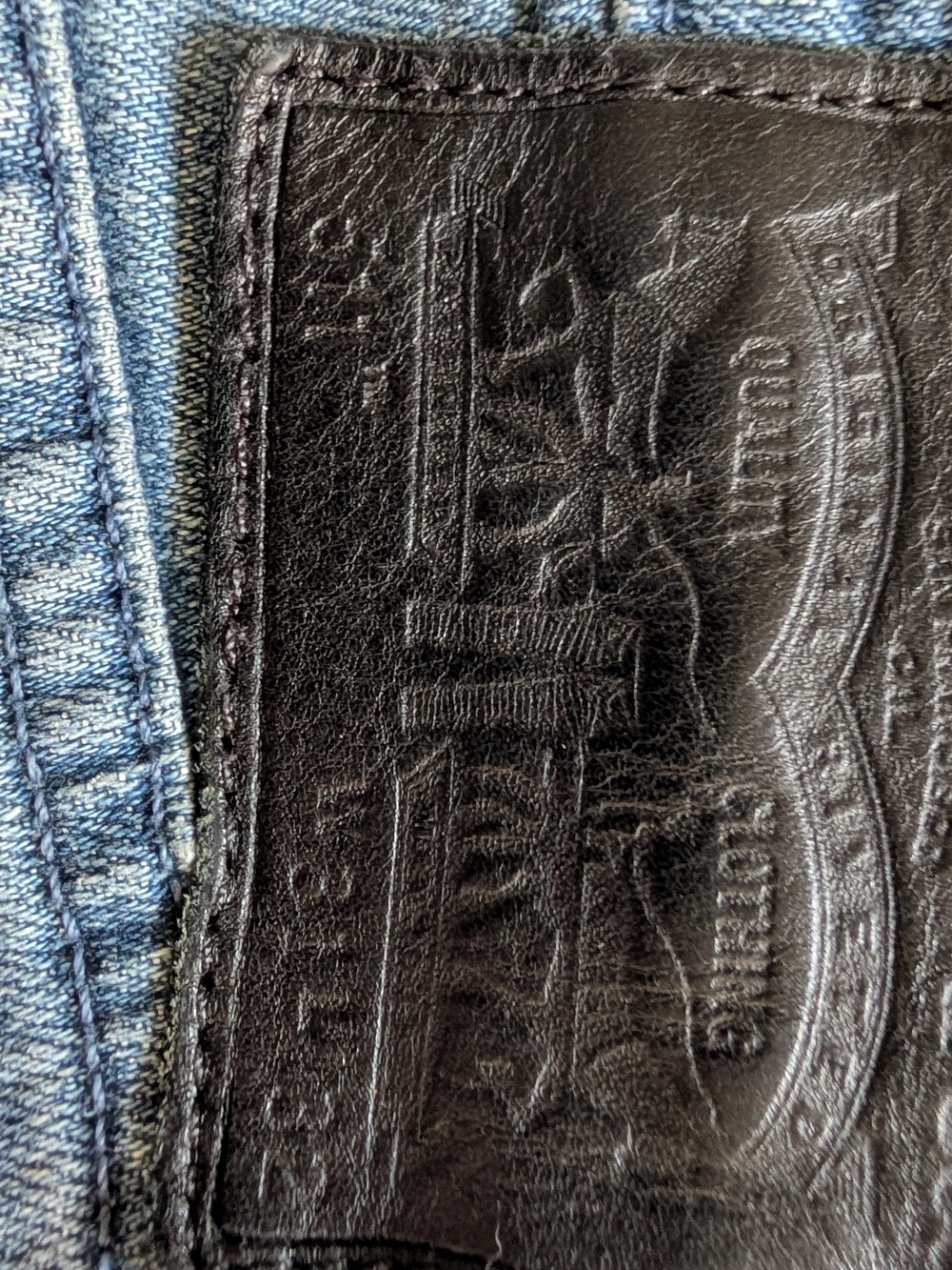 Levi's Slim Blue Jeans with Black Patch